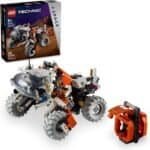 LEGO Technic Mars exploration vehicle with four large wheels, orange and white details, and robotic arm; set box shown in the background.