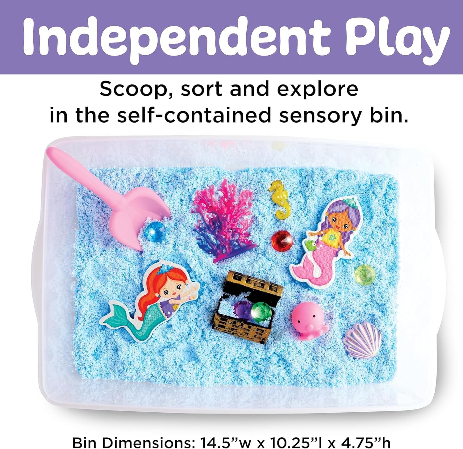 A sensory bin filled with blue sand, a pink scoop, colorful toy gems, a treasure chest, seaweed, a pink shell, and two mermaid cutouts.