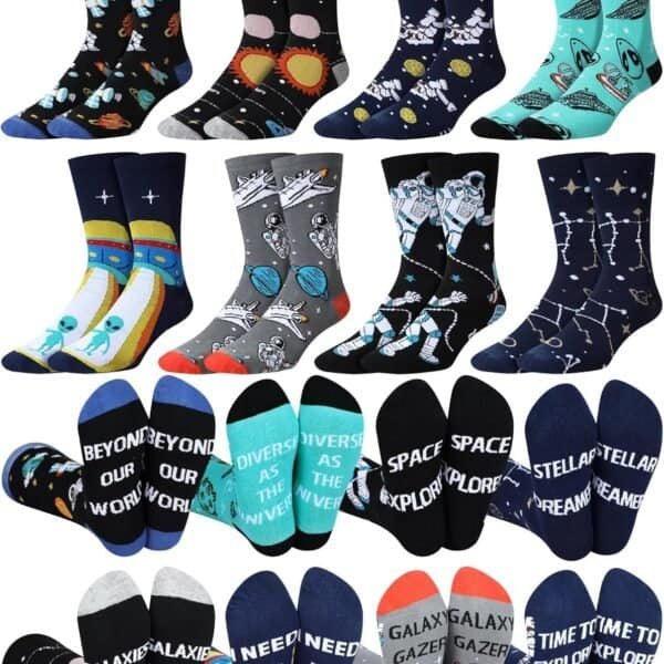 A collection of colorful, space-themed socks with patterns of planets, astronauts, rockets, constellations, and related words displayed on the soles.