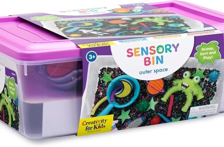 A plastic bin labeled "Sensory Bin Outer Space" contains assorted space-themed sensory toys and tools for children aged 3 and up.