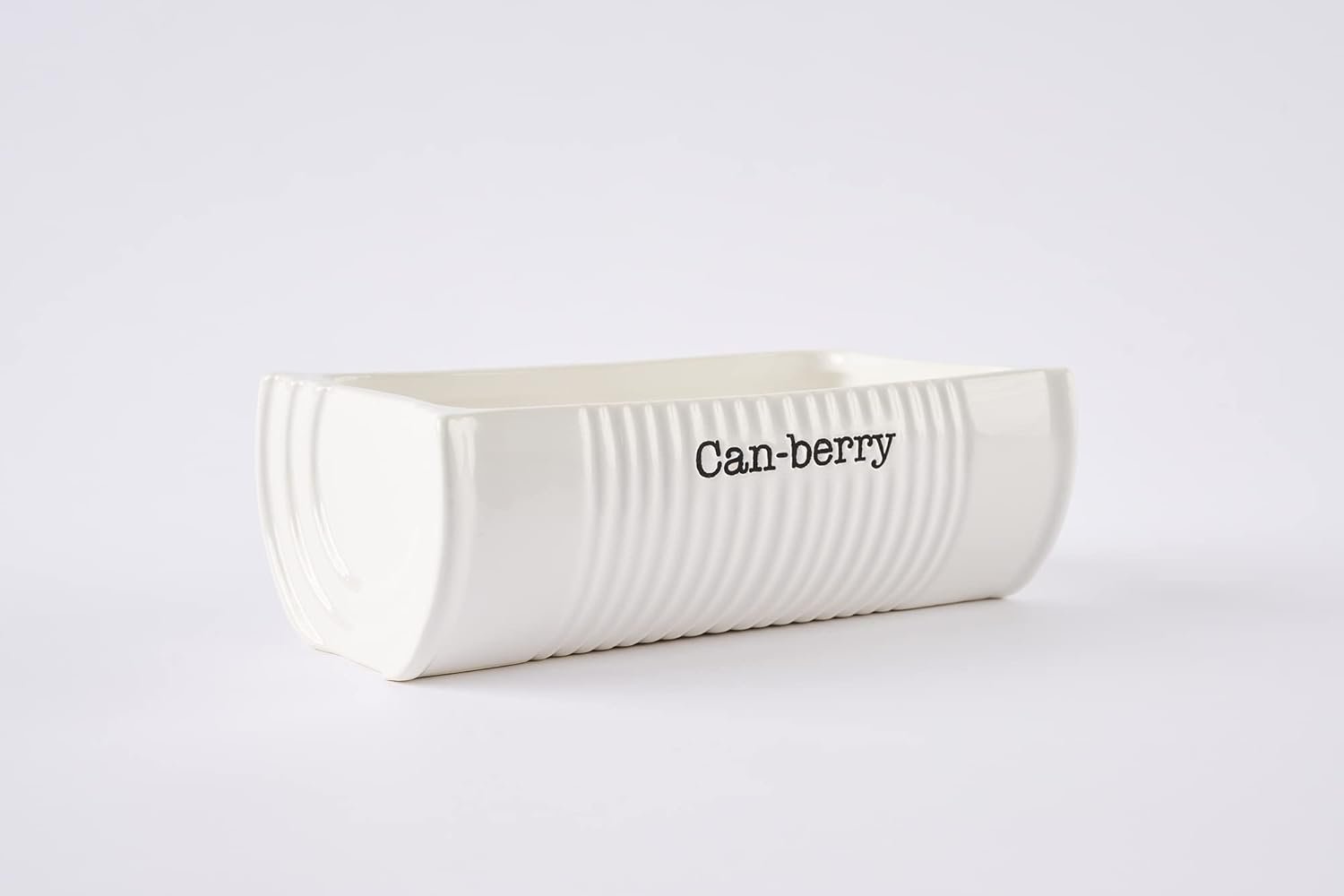 A rectangular white ceramic dish with ridged sides and the word "Can-berry" printed on the front.