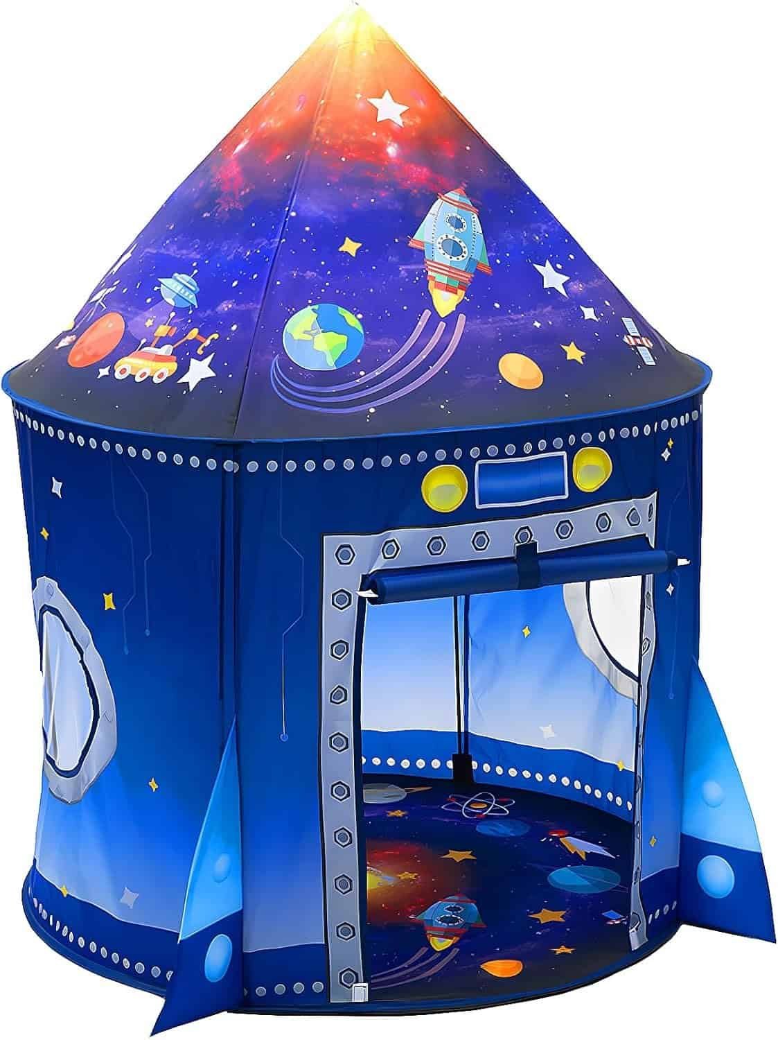 Children’s play tent shaped like a rocket, decorated with space-themed designs such as planets, stars, and rockets, with an open entrance and round windows on the sides.