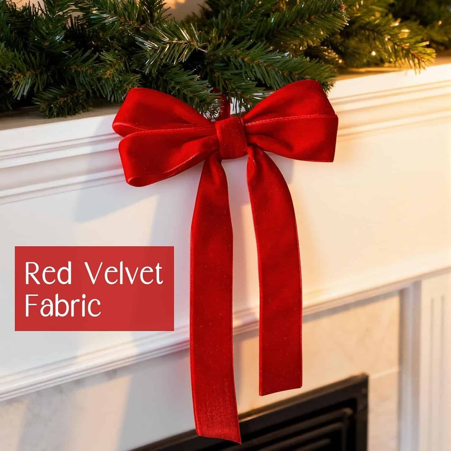 A red velvet fabric bow is attached to a white mantel decorated with green garland.