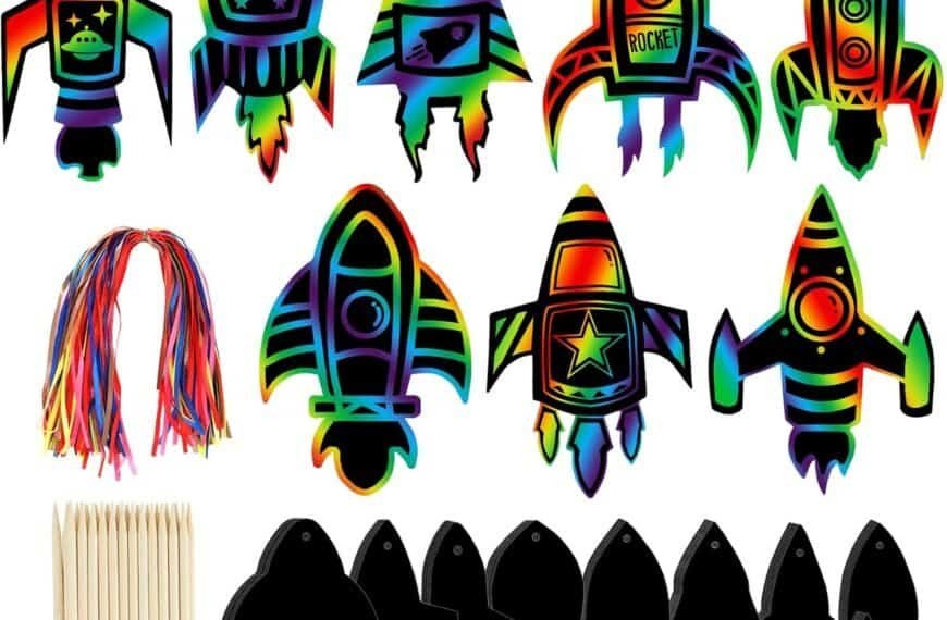 Colorful scratch art rocket shapes, rainbow string bundles, and wooden styluses arranged on a white background for an arts and crafts activity set.