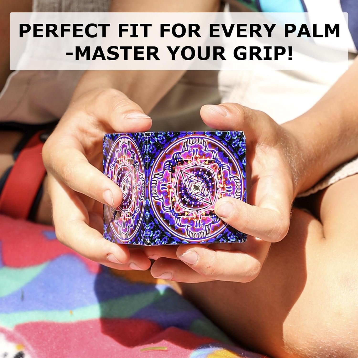 A person holds a colorful, patterned cube with both hands; text above reads, "Perfect fit for every palm - master your grip!.