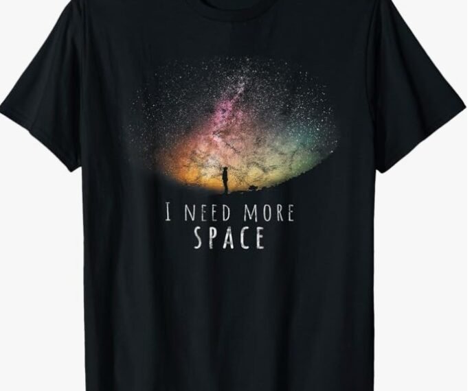 The I Need More Space Funny Galaxy Astronomy Science Pun T-Shirt features a silhouette gazing at a colorful starry sky with the text "I NEED MORE SPACE"—a perfect, unique gift for astronomy fans and science enthusiasts.