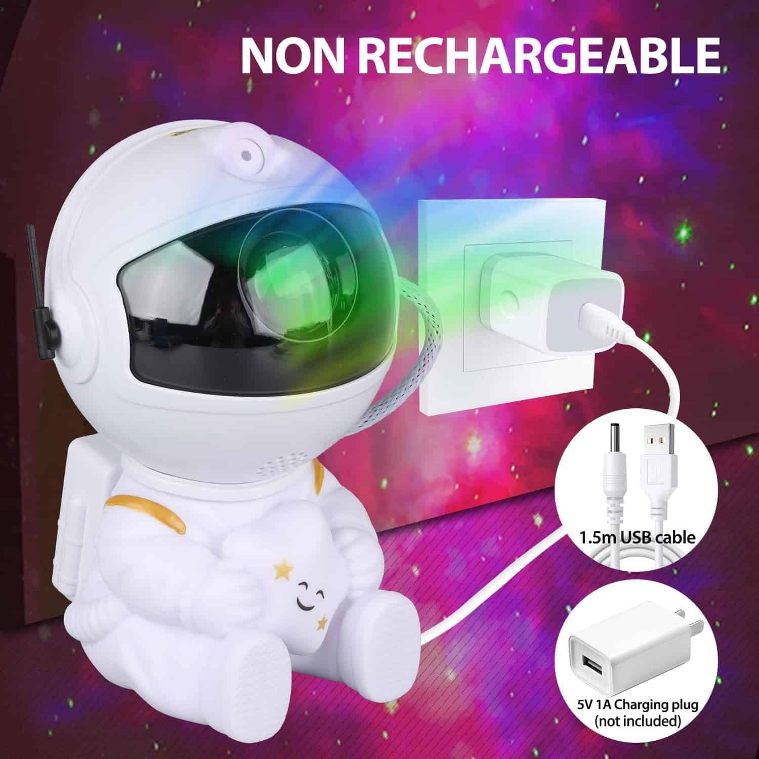 A white astronaut-shaped night light is plugged into a wall outlet via USB cable; text indicates it is non-rechargeable and shows included and not included charging accessories.