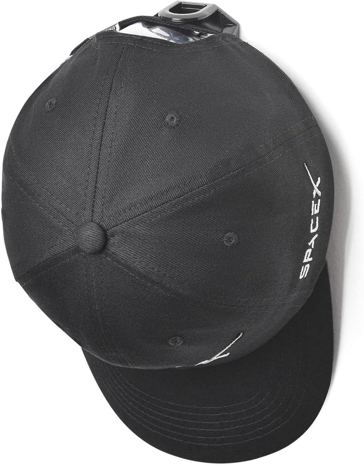 A black baseball cap with the SpaceX logo embroidered in white on the side, viewed from above.