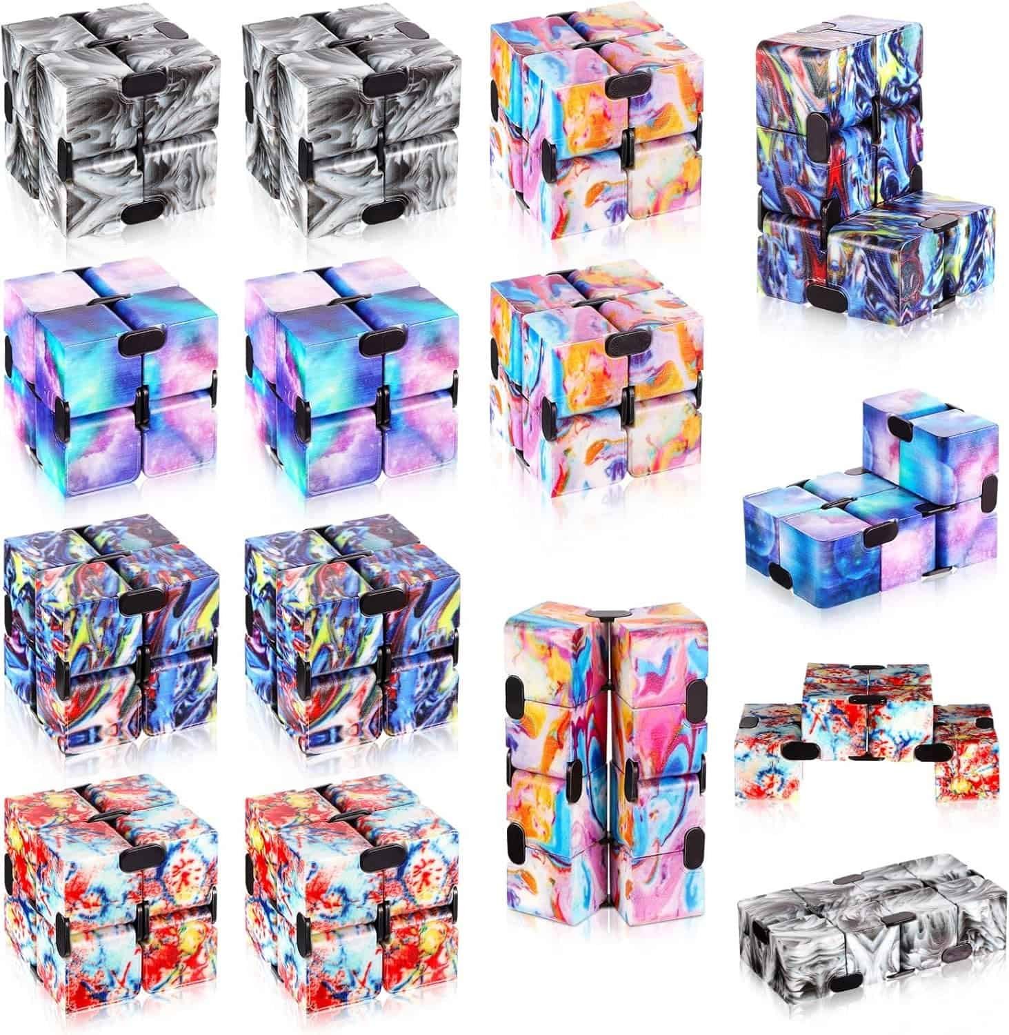 Sixteen infinity cubes are arranged in four rows of four, each displaying different colorful and abstract patterns on their surfaces.