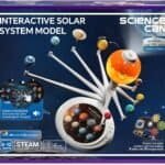 Box of an "Interactive Solar System Model" toy by Science Can, showing a model of the solar system with planets and a projector feature for children aged 6-12.