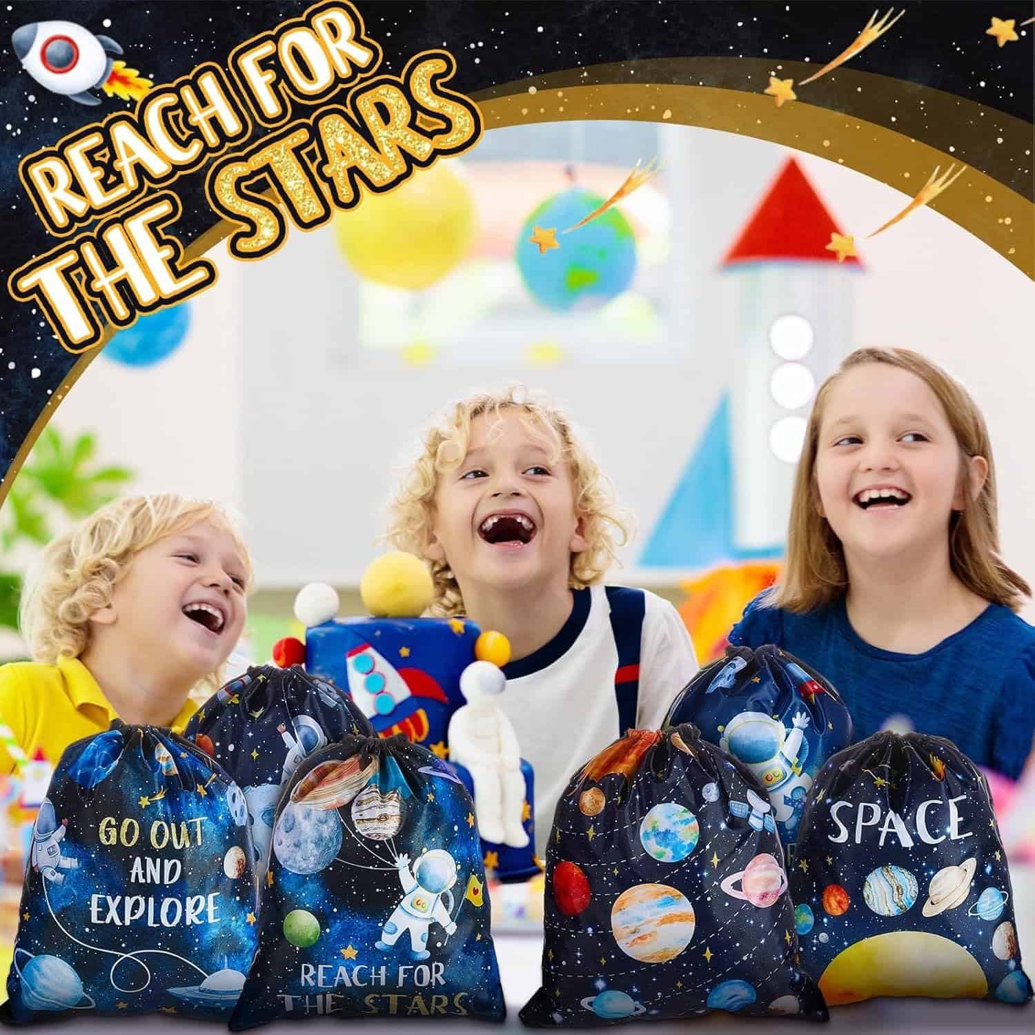 Three children smile and laugh indoors with space-themed drawstring bags in front of them; the background features planets and the text "Reach for the Stars.