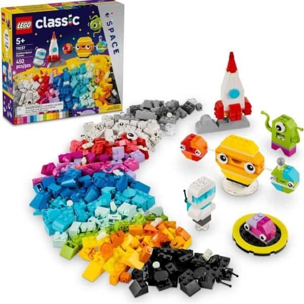 LEGO Classic Space set with colorful bricks spread out, five assembled space-themed figures, a small rocket, and the packaging box in the background.