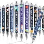 A set of pens with colorful space-themed designs and motivational phrases such as "REACH FOR THE STARS" and "VISIT MARS" printed on the barrels.