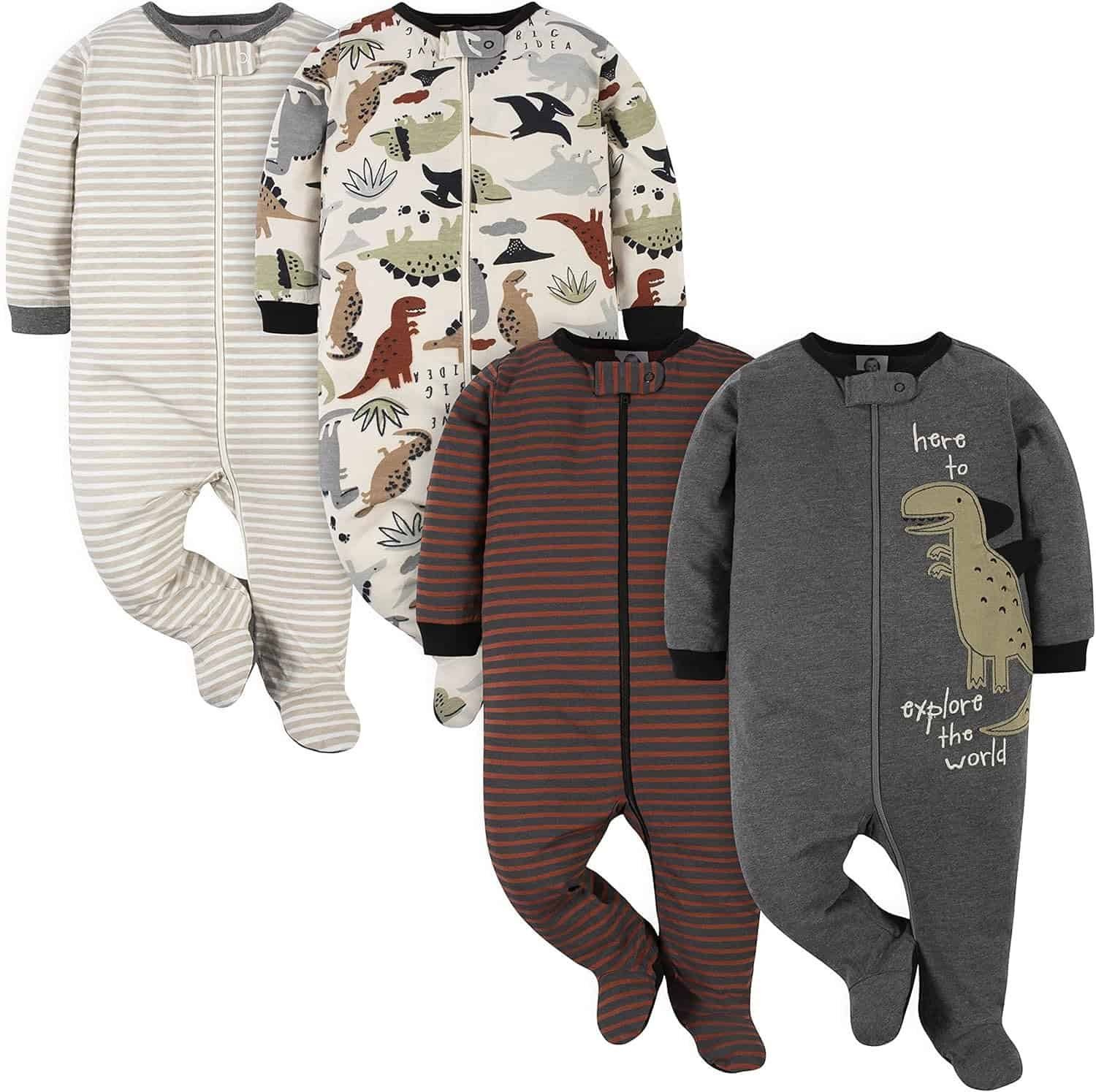 Four infant footed pajamas are displayed: one beige striped, one dinosaur print, one brown striped, and one gray with a dinosaur graphic and text "here to explore the world.