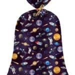 A drawstring gift bag with a space-themed pattern featuring planets, astronauts, rockets, satellites, and stars on a dark background.