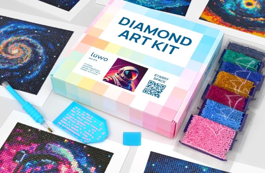 Diamond art kit with a pastel box, sorting tray, stylus tool, wax, colorful beads, and several completed space-themed mosaic artworks displayed around it.