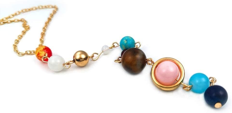 A gold chain necklace featuring assorted colorful beads, including pink, blue, brown, white, and gold, arranged in a linear pattern.