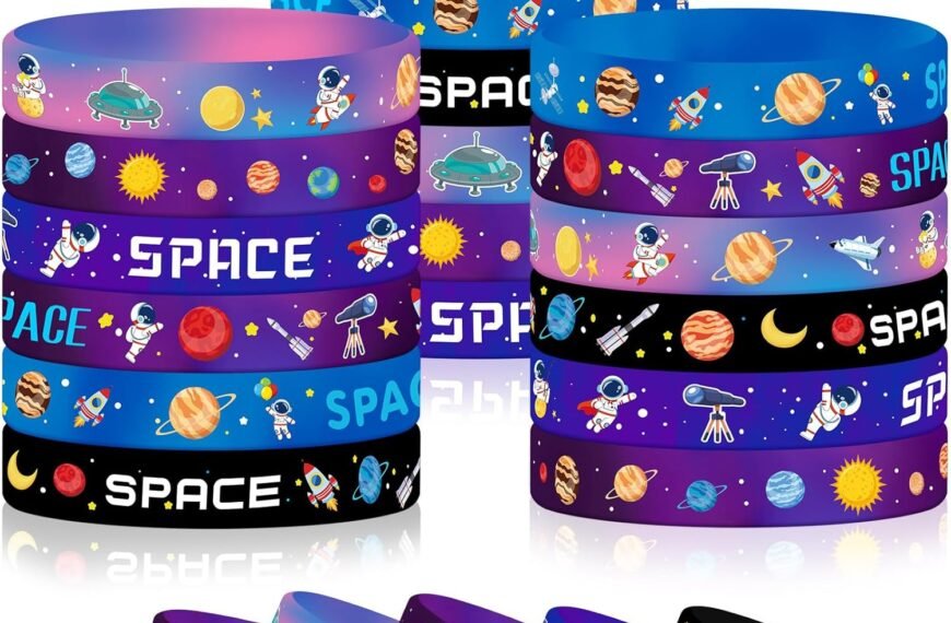 A collection of colorful silicone wristbands with space-themed designs, including astronauts, rockets, planets, and stars, arranged in stacks and rows.