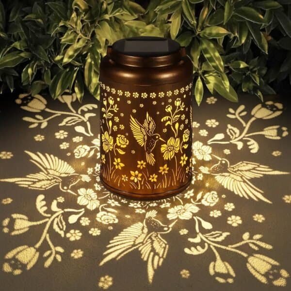 The Solar Lanterns Outdoor Waterproof Hummingbird Garden Decor projects illuminated patterns, adding charm to your yard, patio, or porch. This metal solar light is a perfect garden gift for women, moms, or grandmas and brightens any outdoor space.