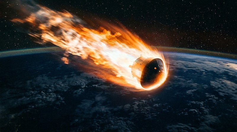 What Did NASA's Artemis II Mission Accomplish? 1 An Artemis II spacecraft capsule reenters Earth's atmosphere, surrounded by flames and plasma, with space and the planet's surface visible below.