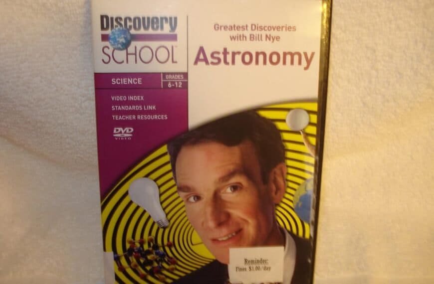 DVD cover for "Greatest Discoveries with Bill Nye: Astronomy," part of Discovery School's Science series for grades 6-12, featuring Bill Nye's face and science-themed graphics.