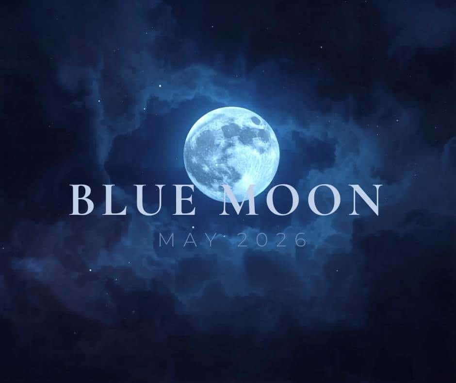 What Is a Blue Moon? The Science Behind May 2026’s Rare Second Full Moon 4 A full Blue Moon glows in a dark, cloudy night sky with the text "BLUE MOON MAY 2026" overlaid in large, pale letters.