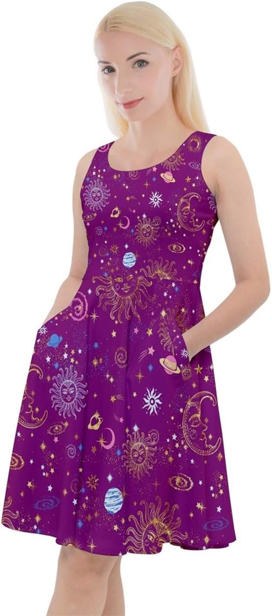 Woman posing in a purple sleeveless dress adorned with constellation and starry night patterns.