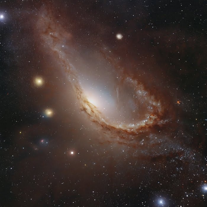 A vivid image of the spiral galaxy NGC 2442, also known as the Meathook Galaxy, featuring bright stars and a distinctive, twisted spiral arm against a backdrop of Earth's Cosmic Address Exploring Our Place in the Milky Way Galaxy (1) - 복사본.
