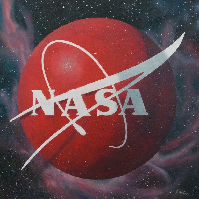 NASA in white font over a large red sphere with a white orbital path, set against a space-themed background with stars and nebulae, inspiring dreams of becoming an astronaut.