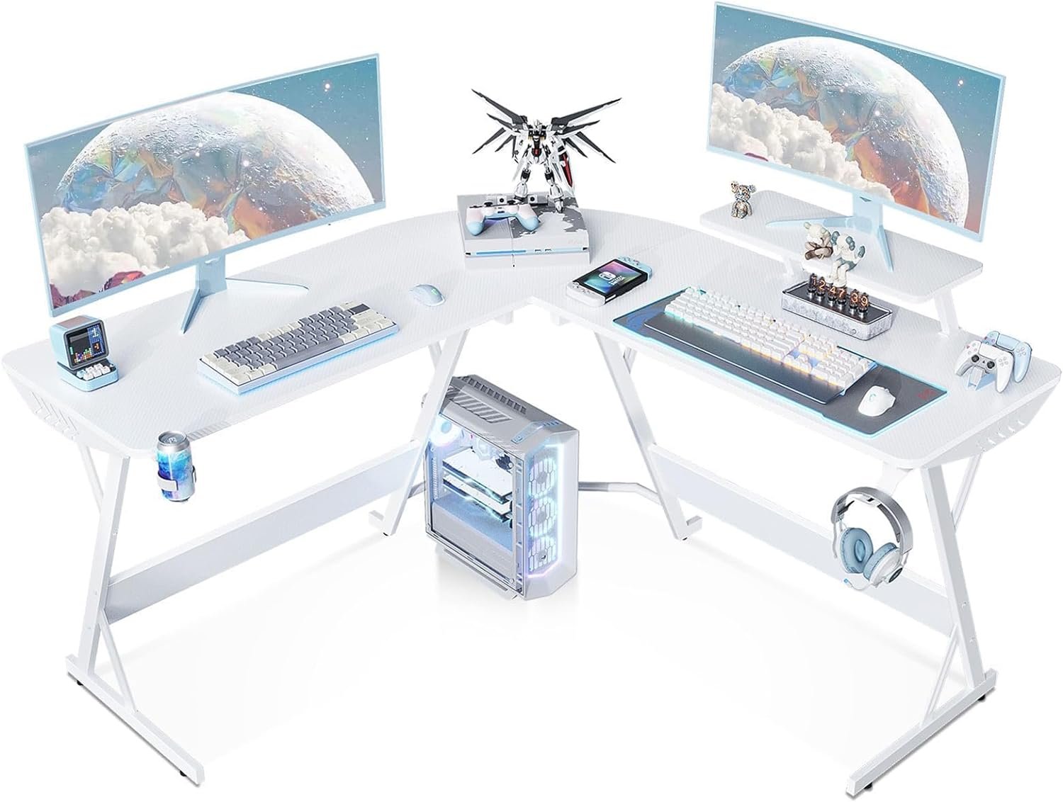 A dual-monitor white corner computer desk setup with desktop PC, gaming equipment, headphones, keyboard, mouse, and various decorative items.