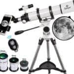 A telescope with adjustable tripod, smartphone attachment, and three eyepieces (25mm, 11mm, 10mm). A remote control and a close-up moon image are also shown.