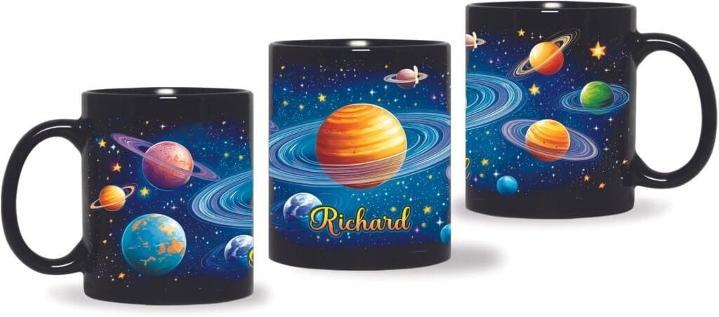 Three black mugs with colorful space-themed designs, featuring planets and stars, with "Richard" printed on one.