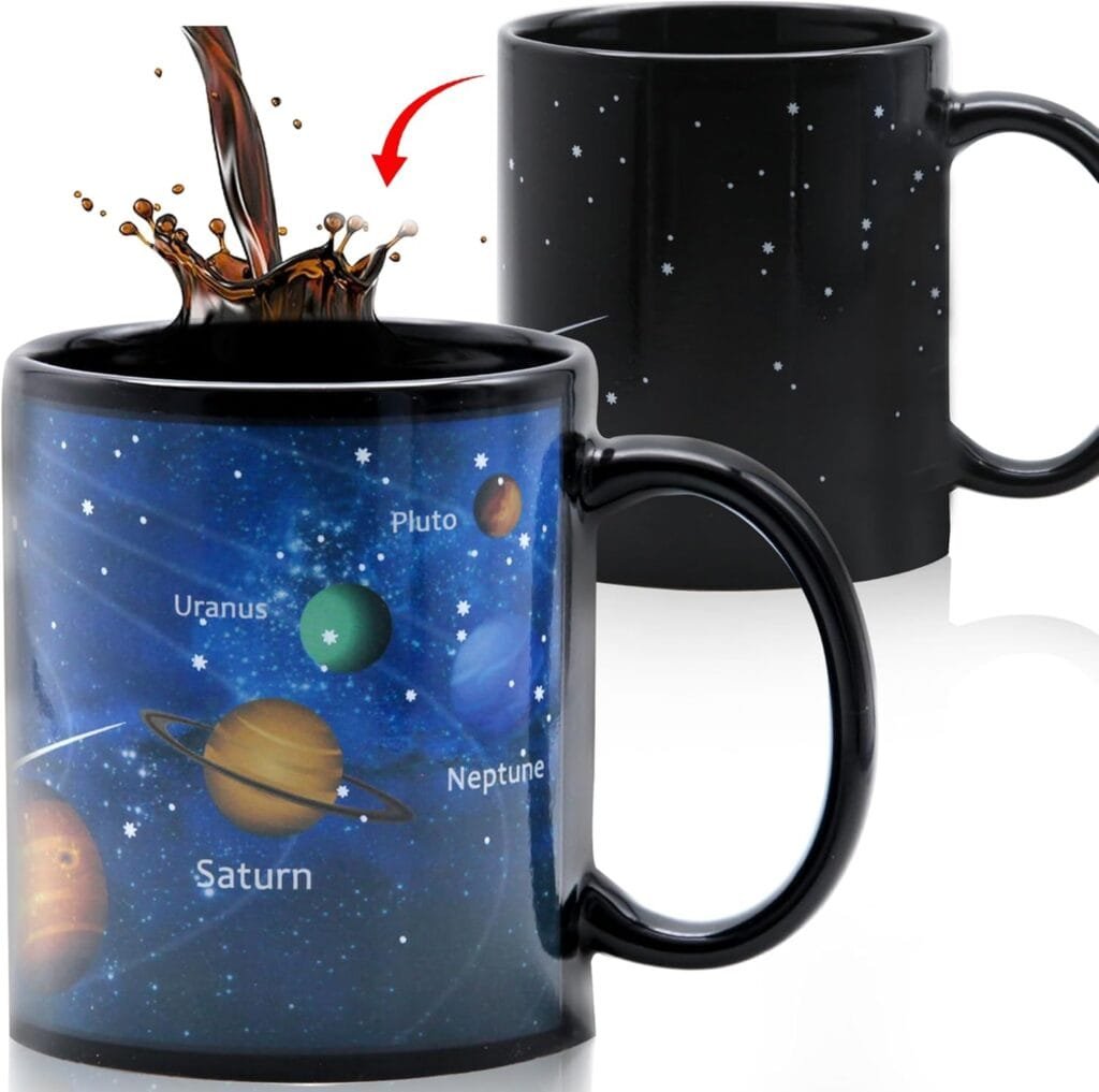 Two mugs with a space theme; one shows planets and stars when filled with liquid.