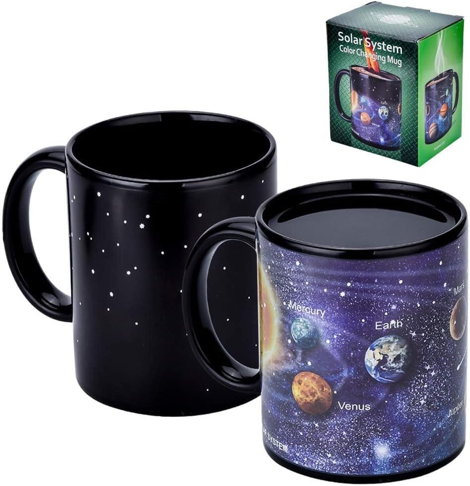 Two color-changing mugs: one black with white dots, one displaying the solar system. Box packaging shown in the corner.