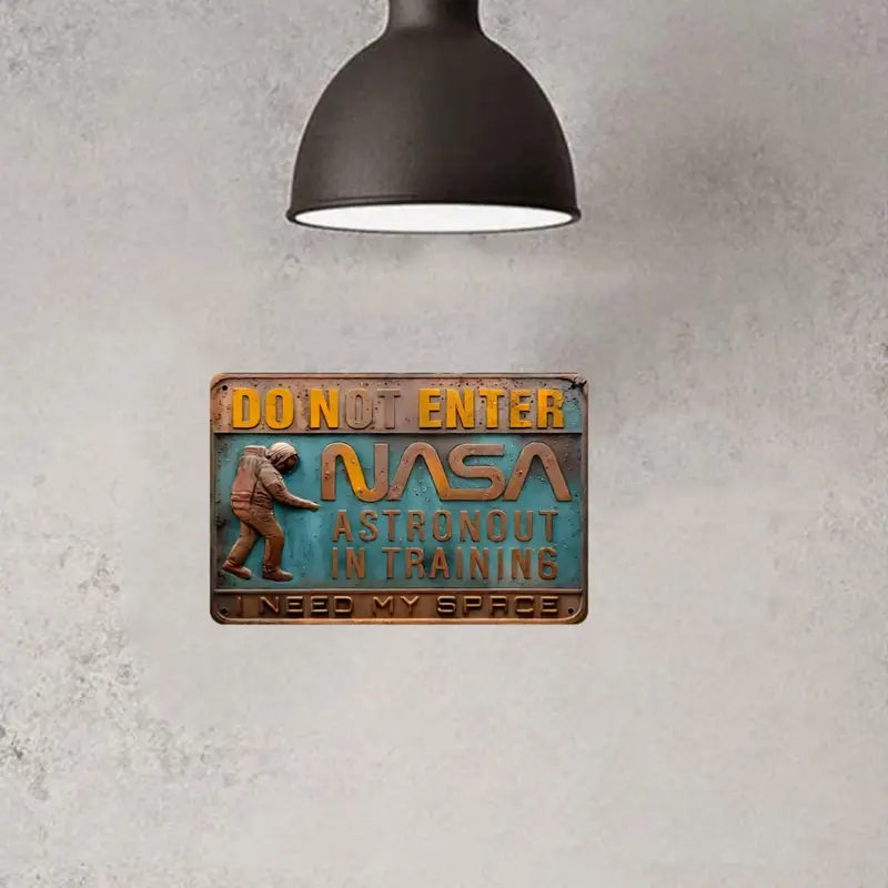 A 3D embossed metal sign reads: "Do Not Enter, NASA Astronaut in Training, I Need My Space!" Ideal for space theme decor enthusiasts. Product: 3D Embossed Metal Sign Astronaut Training | Space Theme Decor.