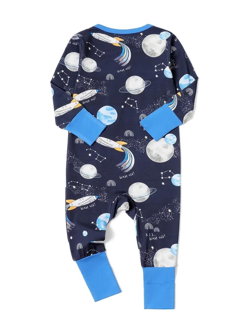 A navy blue children's jumpsuit with space-themed patterns, including planets, rockets, stars, and the phrase "Blast Off!" It has bright blue cuffs on the sleeves and legs.