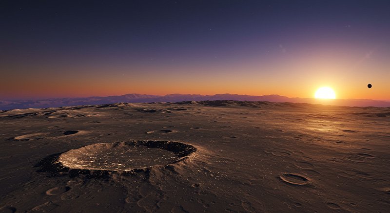 A barren, cratered lunar surface is depicted at sunset. The sun is low on the horizon, casting long shadows across the landscape with a distant celestial body visible in the sky.