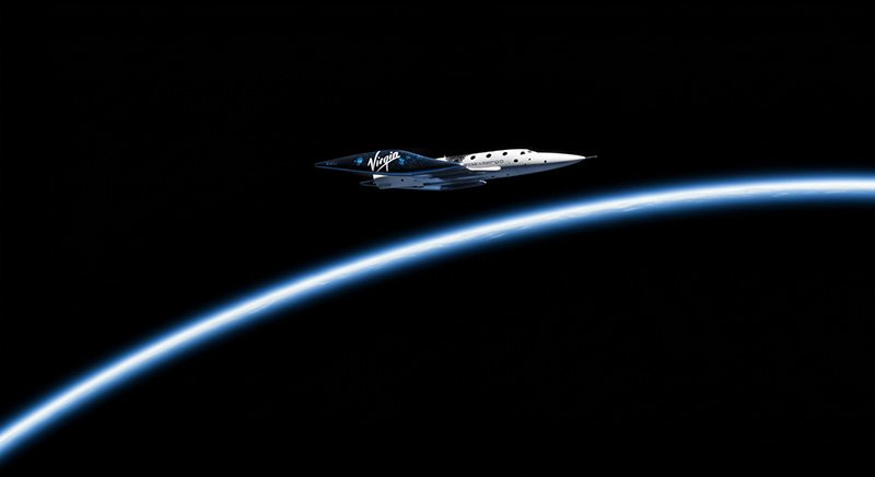 Suborbital vs. Orbital Flights: Which Space Experience Is Right for You? 1 A Virgin Galactic spaceplane flies above Earth's atmosphere during a suborbital flight, with the planet's curved horizon and the darkness of space in the background, offering a breathtaking space experience.