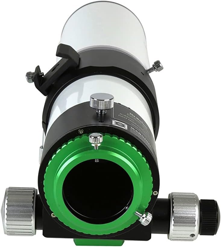A close-up view of a telescope focuser with adjustment knobs and a green accent ring, seen from the eyepiece end.