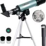 A teal and black refractor telescope on a tripod with eyepieces, a finder scope, a moon image, and an additional lens accessory displayed alongside.