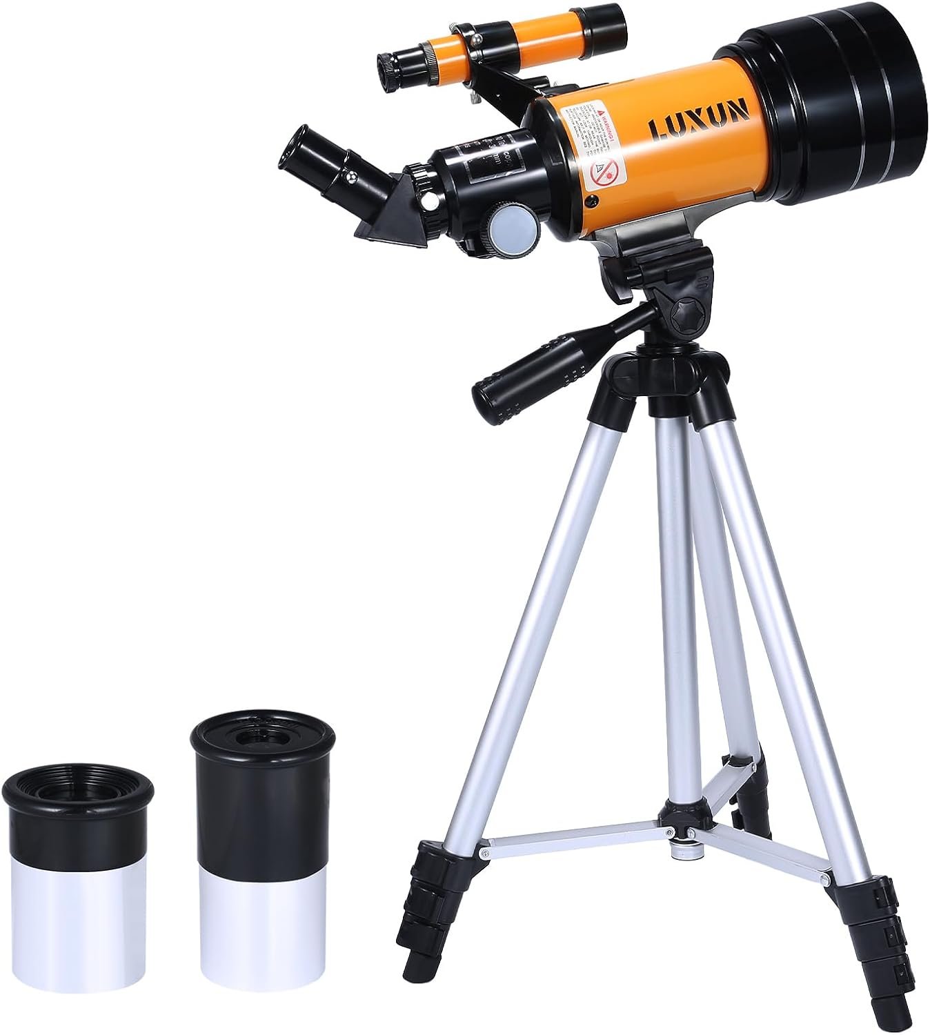 A tabletop orange and black telescope on a silver tripod, with two additional eyepieces placed beside it on a white background.