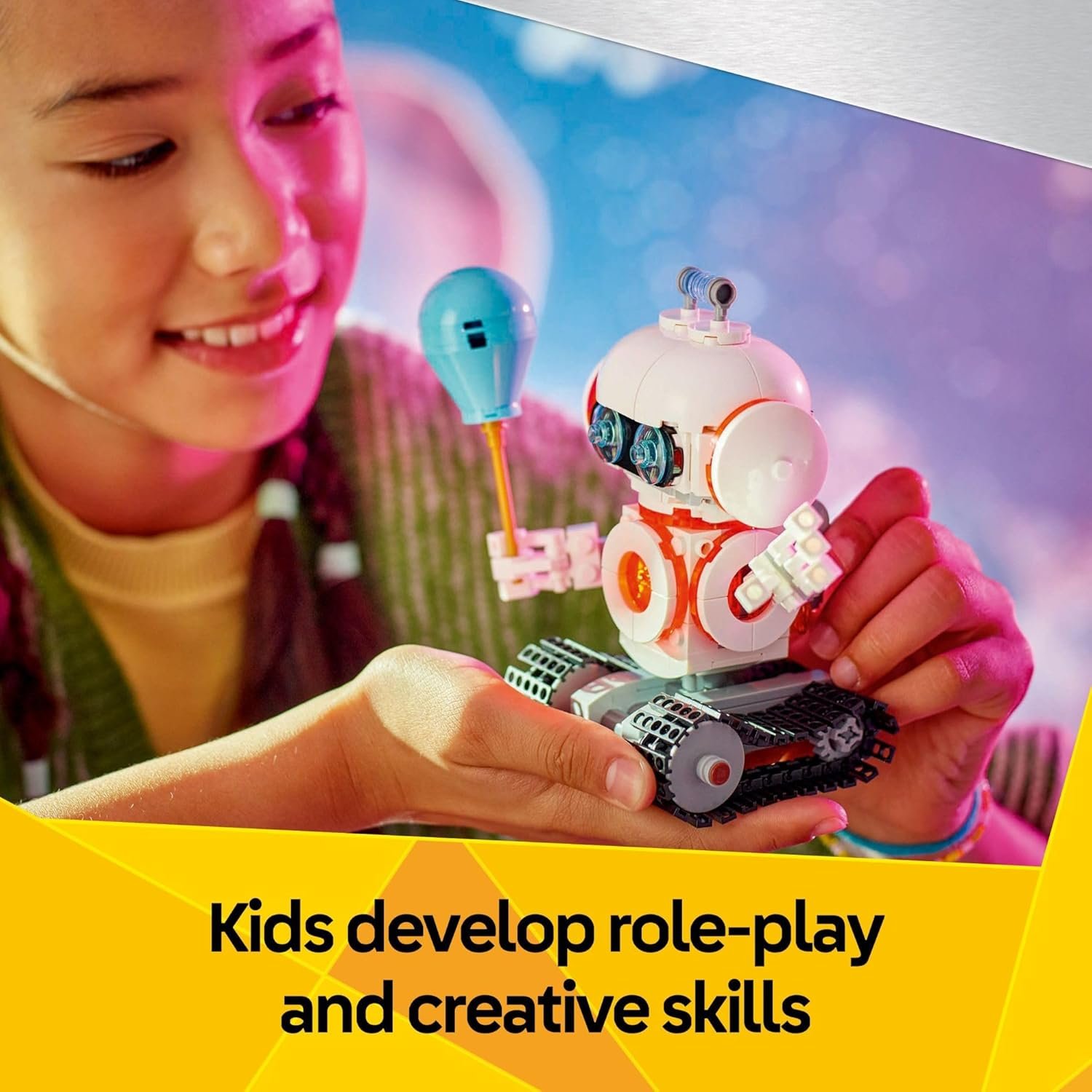A child holds a small toy robot with tracks and a balloon, with text stating, "Kids develop role-play and creative skills.