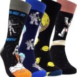 Four pairs of socks with space-themed designs, including astronauts, planets, and rockets, in various colors such as black, blue, and gray.