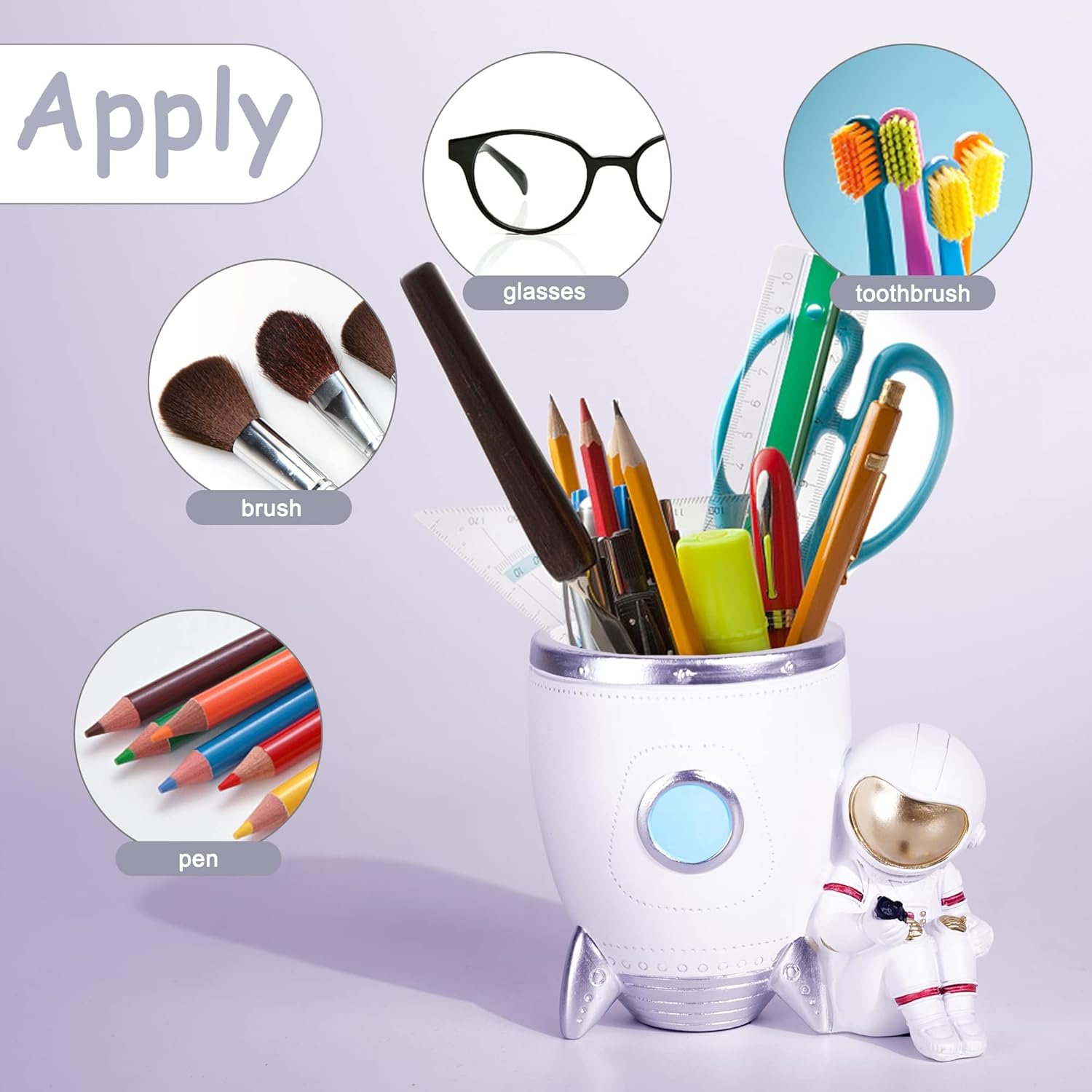 White rocket-shaped holder containing assorted stationery items, with labeled icons showing it can hold glasses, toothbrushes, brushes, and pens; astronaut figurine attached to holder.