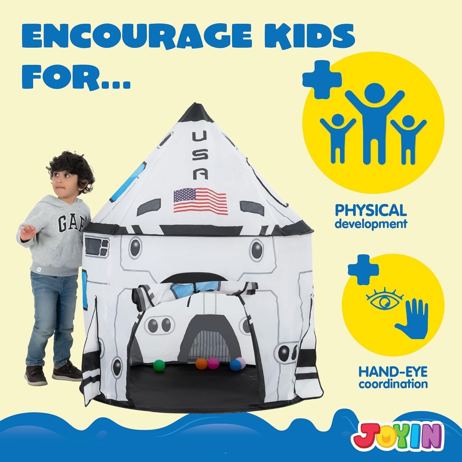 A young child stands beside a space-themed play tent labeled "USA," with text promoting physical development and hand-eye coordination benefits.