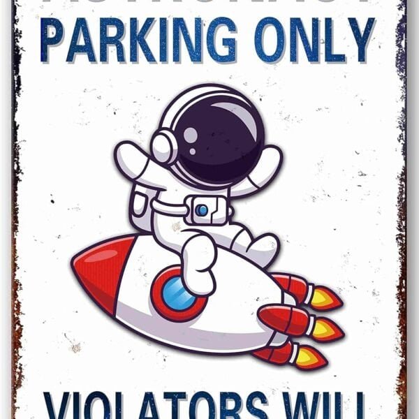A sign reads "Astronaut Parking Only. Violators Will Be Mooned" with a cartoon astronaut riding a rocket.