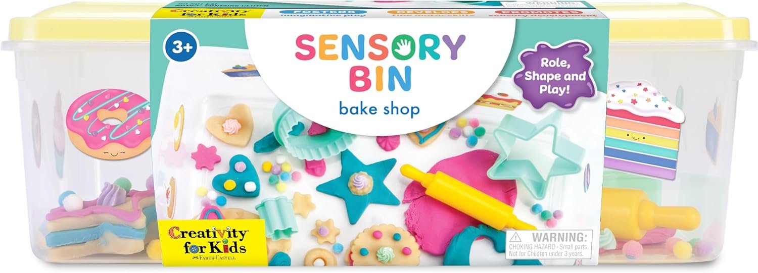 A sensory bin bake shop kit for children ages 3 and up, featuring colorful play dough, shapes, and baking-themed accessories in a clear plastic container.
