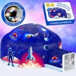 Inflatable space-themed dome tent with printed rockets and astronaut, LED lights with remote control, and air blower attachment; product box shown in upper right corner.