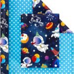 Gift wrap with a space birthday theme, featuring astronauts, planets, and party items on one side, and blue with white polka dots on the other side.