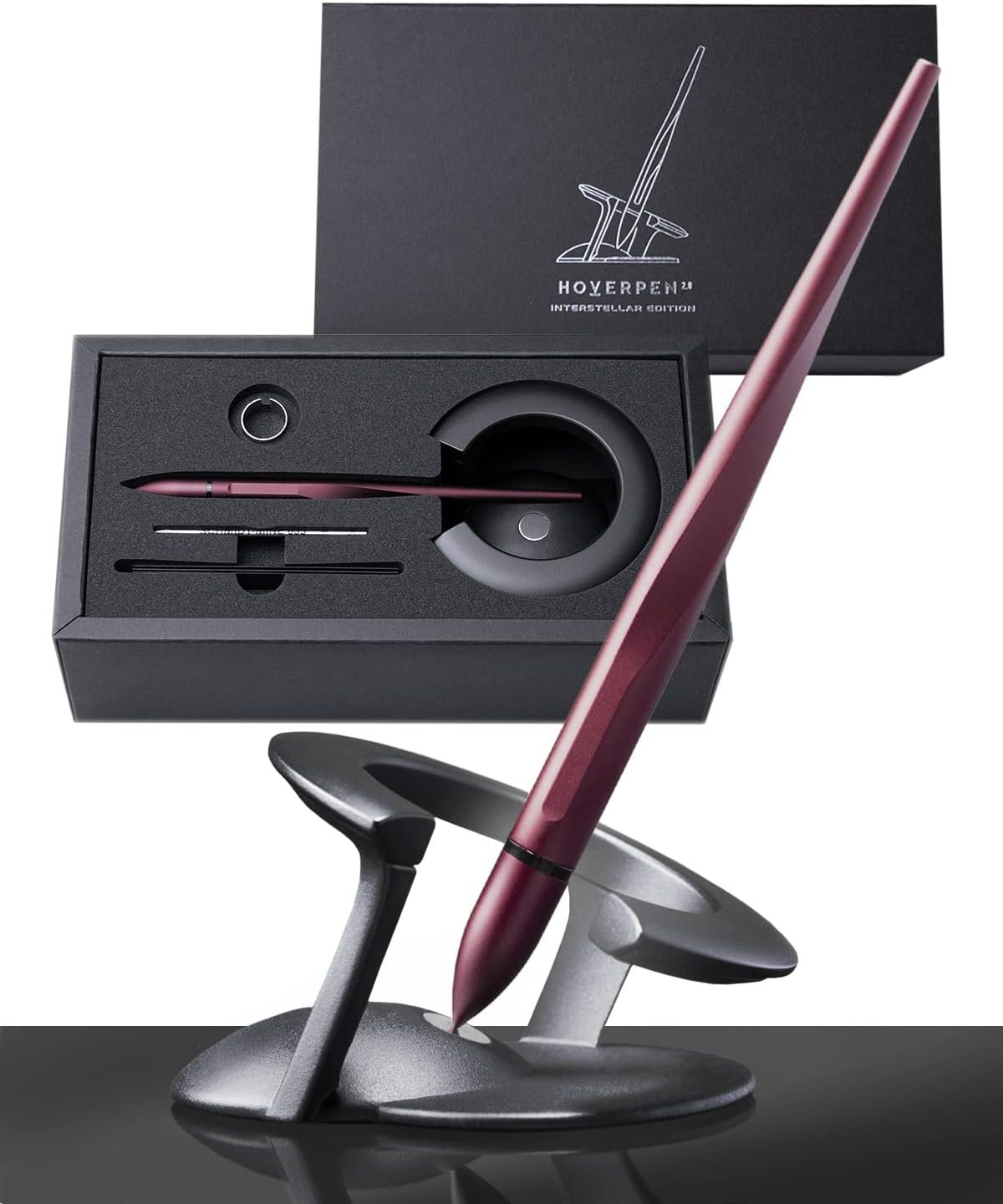 A sleek metallic pen in a modern desk stand, with its packaging and box showing an outlined pen design and the label “HOVERPEN Interstellar Edition.”.